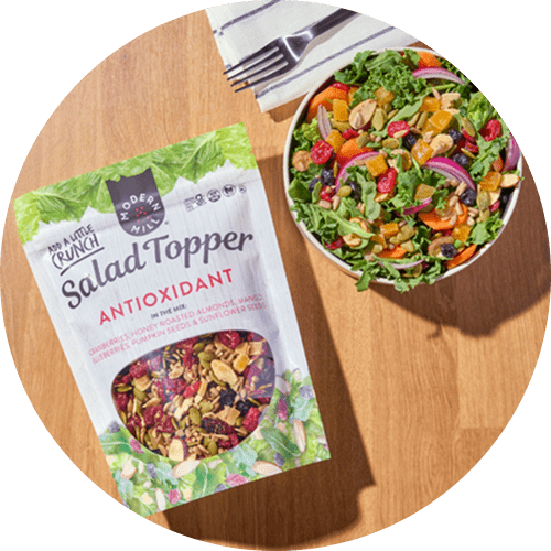 Modern Mill Antioxidant bag next to a bowl of salad