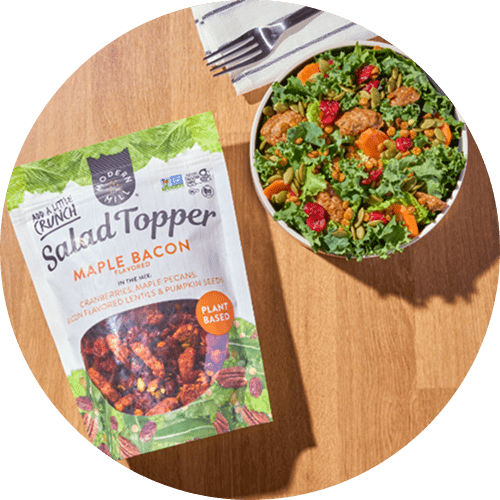 Modern Mill Maple Bacon bag next to a bowl of salad